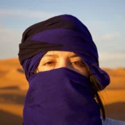 Woman in Sahara scarf exploring Moroccan medina at Morocco travel destinations