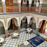 Traditional riad marrakech courtyard with fountain and moroccan tiles